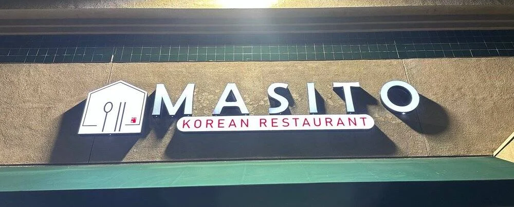 The Masito channel-letter sign above the restaurant entrance